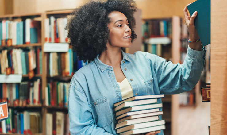 Woman shelving books in the library