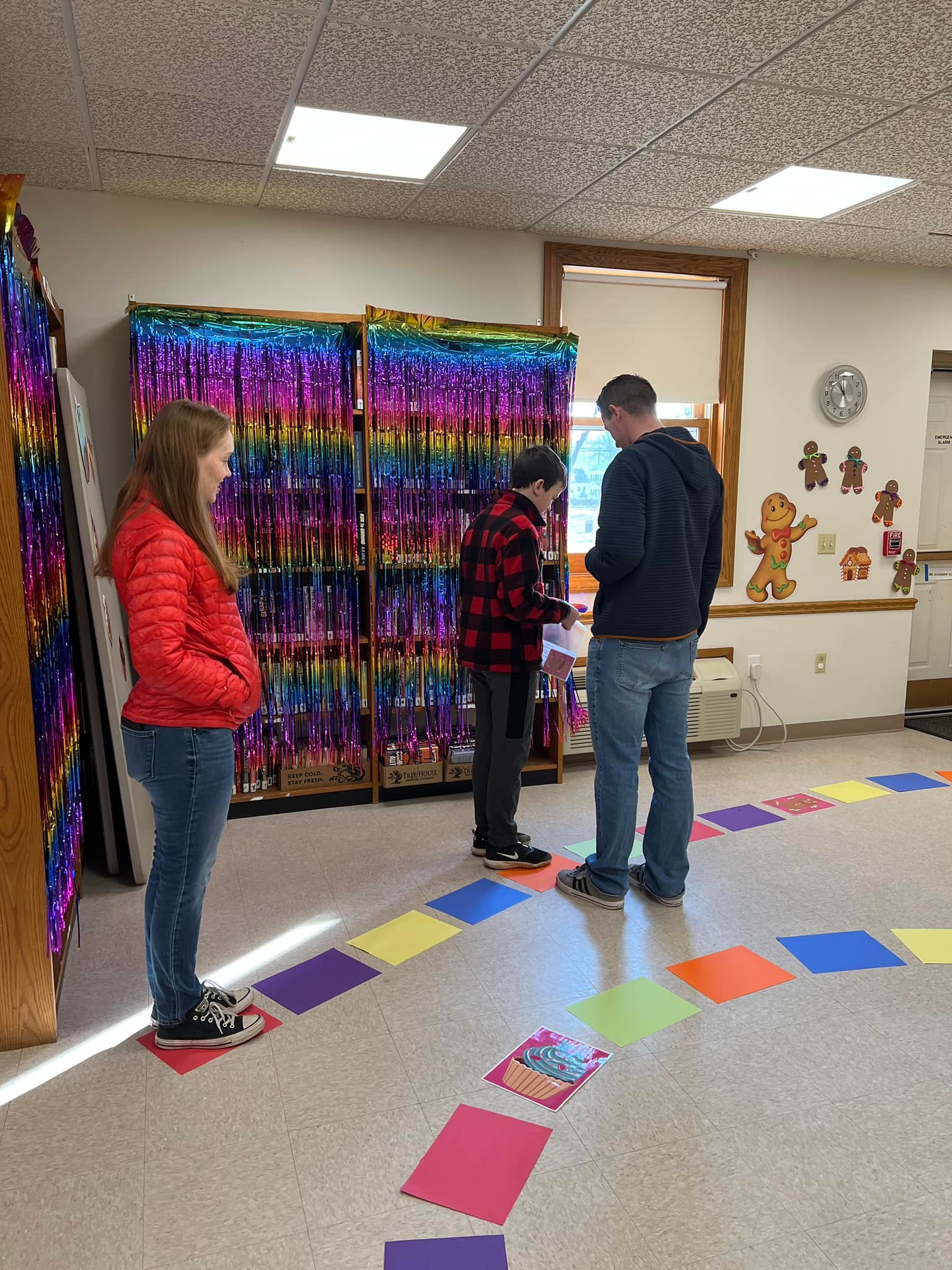 Life Sized Candy Land - 2 adults and 1 child playing candy land