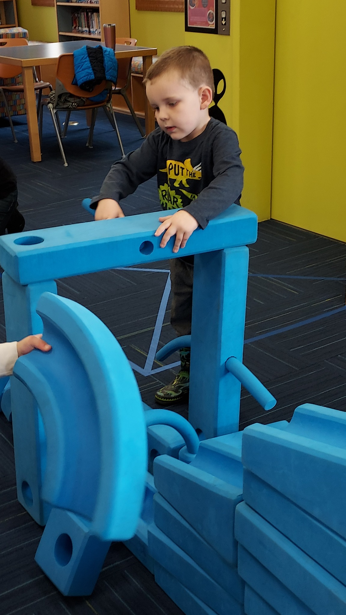Imagination Playground - child climbing on playground