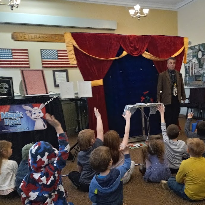 Magic Fred Show children raising hands 