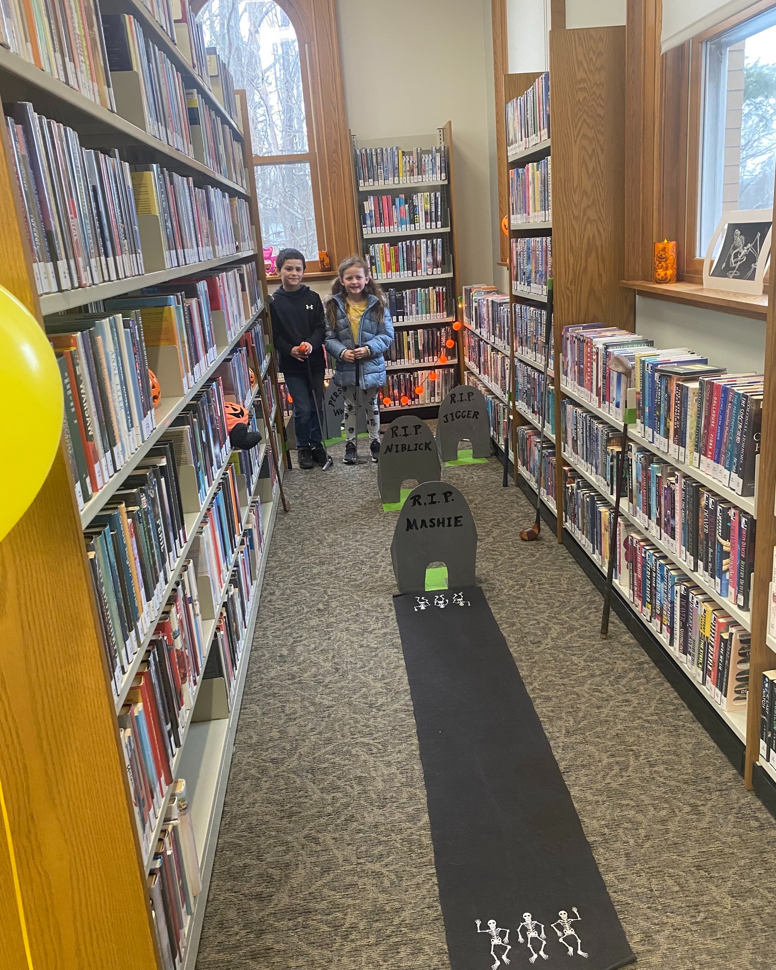 Headstones hole in book stacks