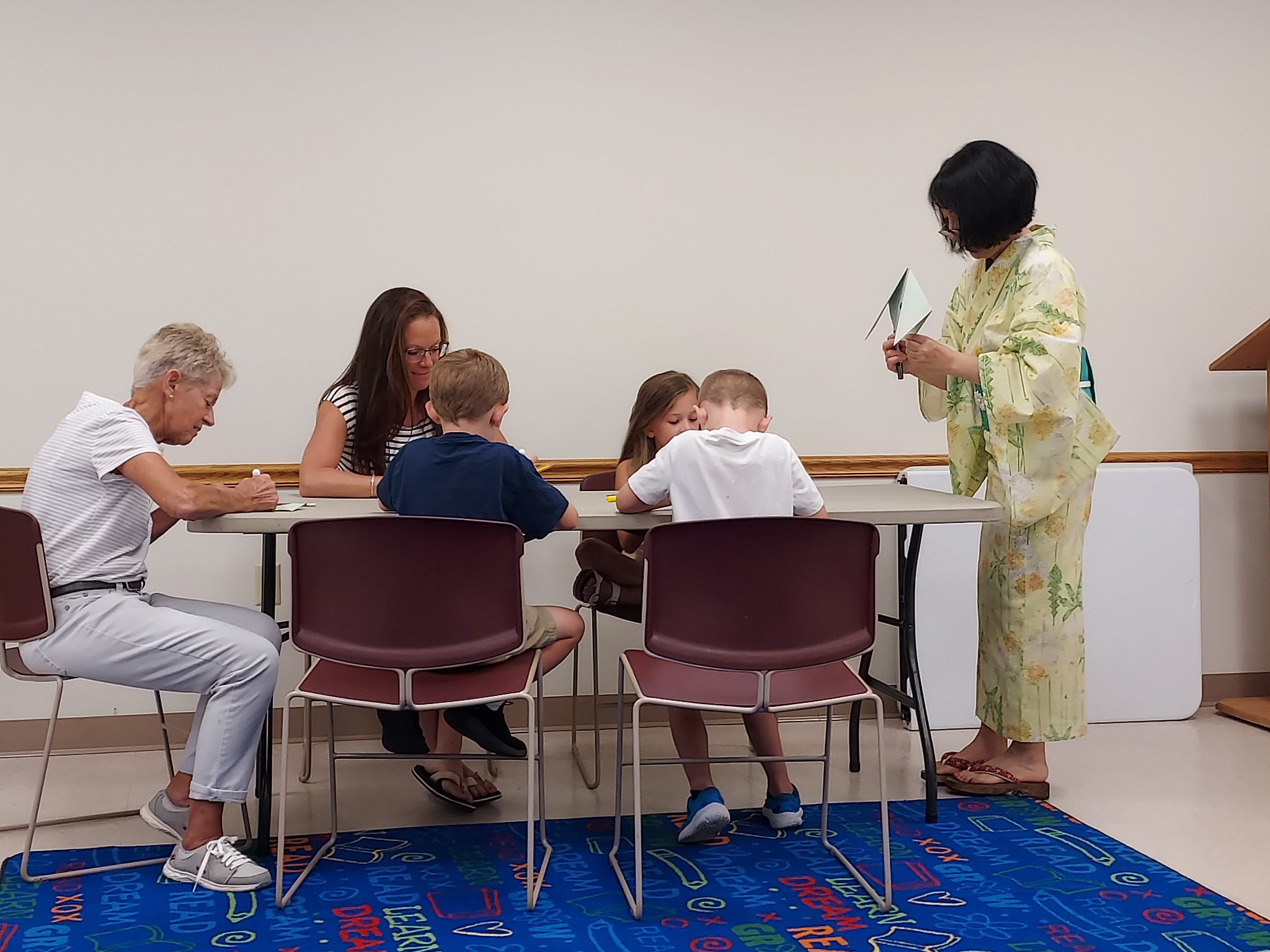 Origami Storigami small group working with Motoko on their pieces