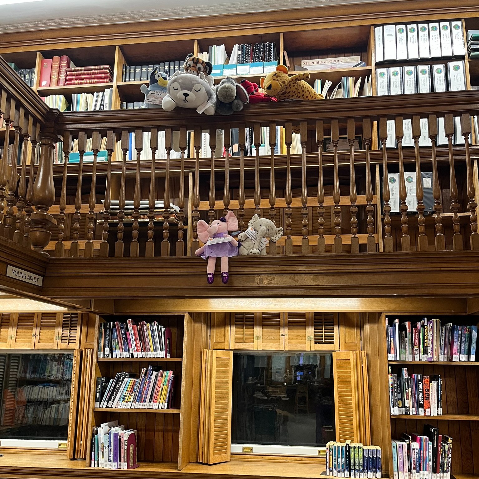 Animals hanging off railings