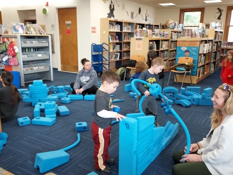Room filled with blue building pieces (Imagination Playground)