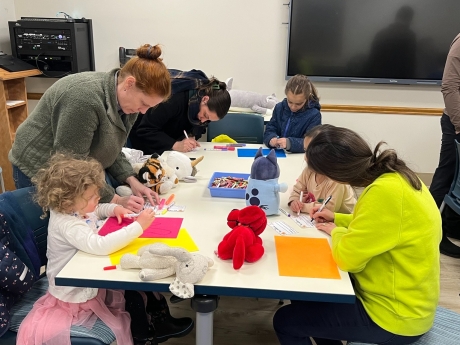 Group of kids drawing at table