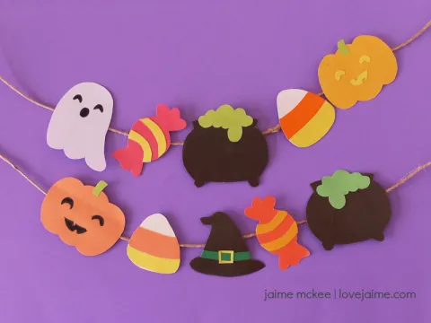 A Halloween-themed DIY garland on a purple background.