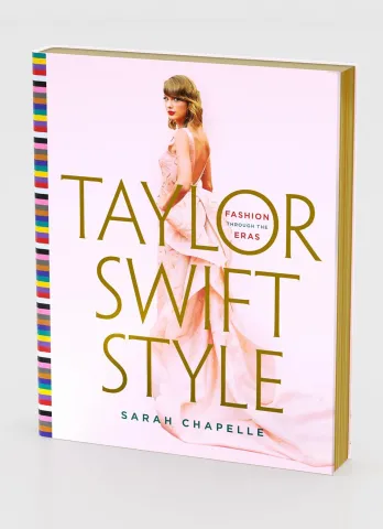 Book cover titled "Taylor Swift Style" by Sarah Chapelle, featuring a woman in a pink dress looking over her shoulder. The mood is elegant and chic.