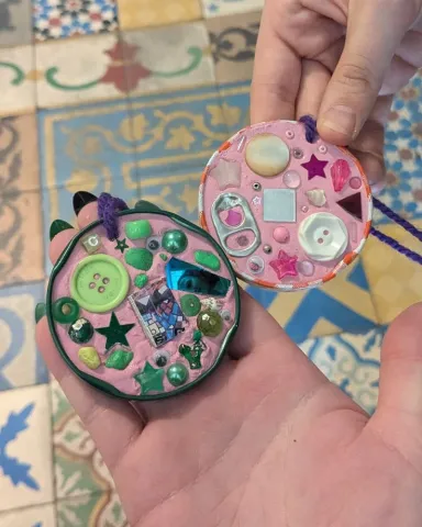 Trinket dishes made from clay and decorated with buttons, mosaic pieces, and gems.
