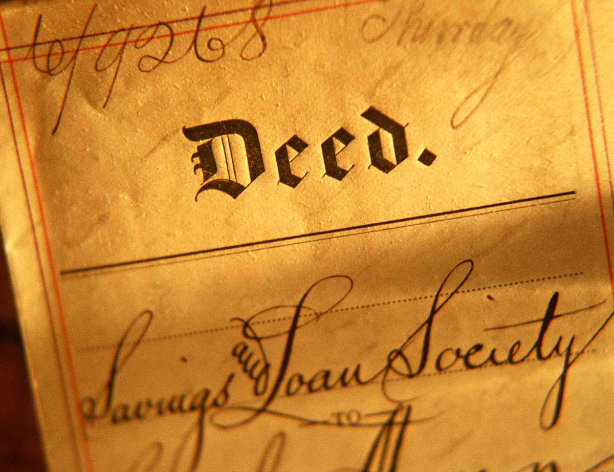Piece of old paper with the word Deed written on it
