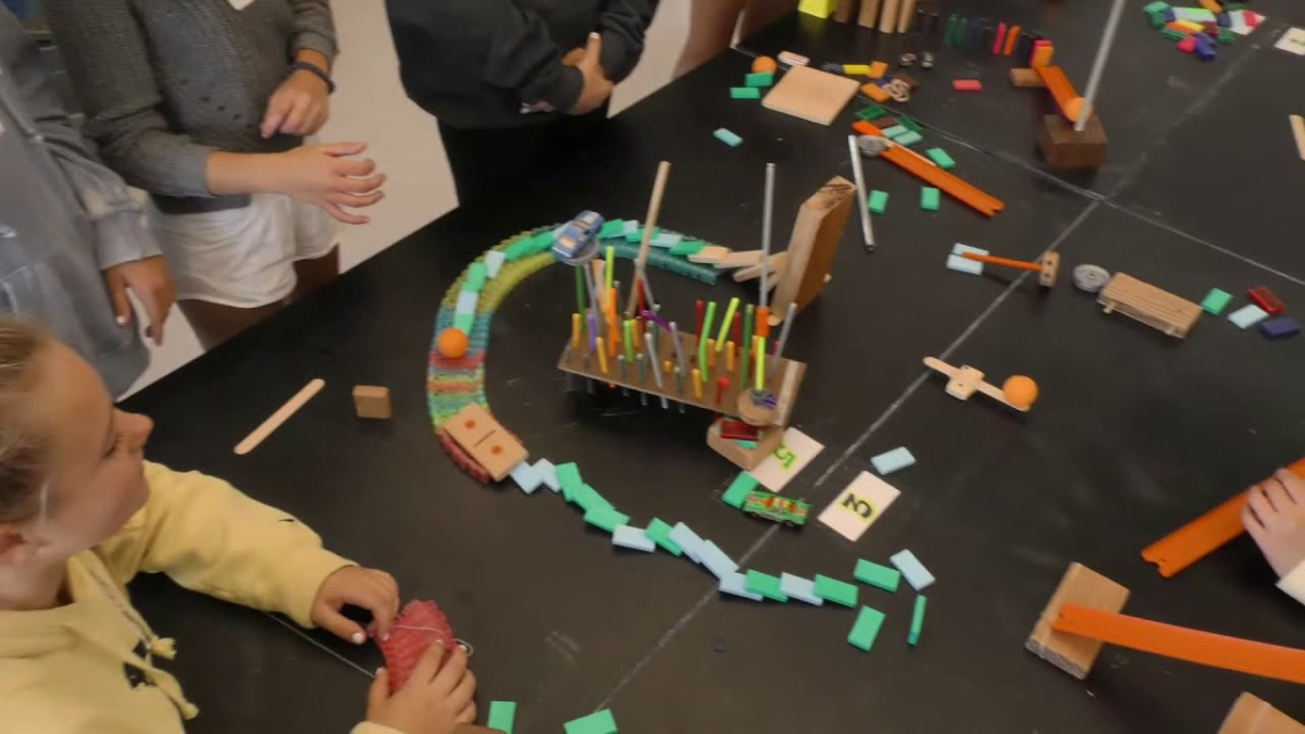 An example of a Rube Goldberg machine made by a child during this program.