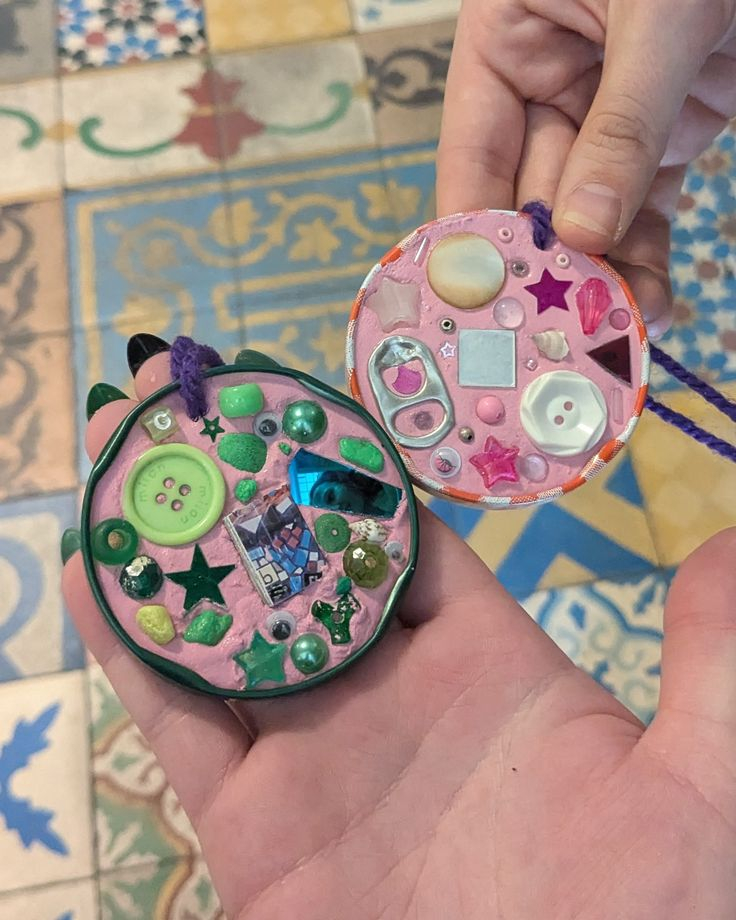 Trinket dishes made from clay and decorated with buttons, mosaic pieces, and gems.